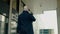 Silhouette of Bald Man Walk and Speak by Smartphone .