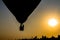 Silhouette balloon floating in the air with the light of the evening sun.