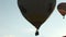 Silhouette of balloon going into the sky