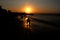 Silhouette on the beach at sunset