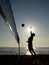Silhouette of beach volleyball player