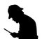 Silhouette of bearded man investigating with a magnifying glass