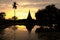 Silhouette of beautiful ancient pagoda reflection on the water.