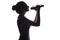 Silhouette of beautiful girl with hand-picked hair singing into microphone, profile of young woman face performing lyric song on