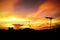 Silhouette of Beautiful sunset with television antenna or telecommunications towers, Orange sky with clouds.