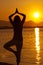 Silhouette of a beautiful woman excercising Yoga