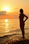 Silhouette beautiful woman standing on beach