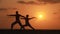 Silhouette of a beautiful Yoga couple