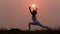 Silhouette of a beautiful Yoga woman