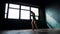 Silhouette beautiful young boxing woman training punching in fitness studio slow motion