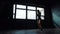 Silhouette beautiful young boxing woman training punching in fitness studio slow motion