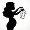 Silhouette of a beautiful young pregnant woman keeps children`s sliders