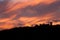 Silhouette of Bellver castle against dramatic sunset sky. Palma, Majorca