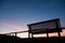 Silhouette of bench at sunset