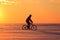 Silhouette of a bicyclist at sunset.