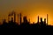 Silhouette of big oil refinery factory during sunset