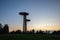 Silhouette of the  bird-nest looking public watchtower