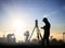 Silhouette black man survey and civil engineer stand on ground w