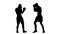 Silhouette. Blows to the body, two men boxers training