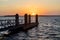 Silhouette Of A Boat Dock At Sunset