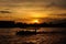 Silhouette of the boat at sunset at Chao Praya river. Bangkok, T