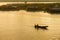 Silhouette of Boating Man boat ride in the river at sunset in Sa