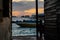 Silhouette of boats and unidentified man working early morning during sunrise in Semporna, Sabah, Malaysia