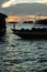 Silhouette of boats and unidentified man working early morning during sunrise in Semporna, Sabah, Malaysia