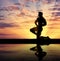 Silhouette of bodybuilder posing at sunset