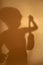 Silhouette of boy holding violin