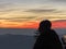 A Silhouette of a boy looking to the sunset from Uetliberg Zurich Switzerland.