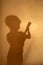 Silhouette of boy playing guitar