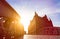 Silhouette of Bridge and Buildings in evening sun rays in low angle view. Speicherstadt Hamburg. Famous landmark of old