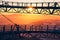 Silhouette of bridge of lookout tower Stezka v oblacÃ­ch in Czechia with view on mountains at suns