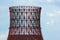 Silhouette of building power plant cooling tower against blue sk