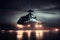 silhouette of business class helicopter on runway at night