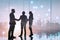 Silhouette business people shake hand and negotiation in office, successful discussion concept