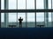 Silhouette Businessman At The Airport Lobby Window