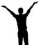 Silhouette of businessman with arms raised.