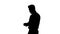 Silhouette Businessman is counting money.