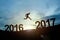 Silhouette of businessman glowing jump 2016 to 2017. success con