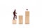 Silhouette of a businessman lifting wooden blocks