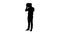 Silhouette businessman putting hardhat helmet on. Safety.