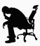 Silhouette of businessman sitting with hand on his head.