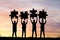Silhouette of Businessmen holding jigsaw in sunset , concept as