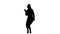 Silhouette Businesswoman dancing wildly celebrating successful project.