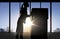 Silhouette of businesswoman moving boxes at office