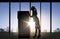 Silhouette of businesswoman moving boxes at office