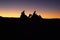 Silhouette of camel riders at Moroccan desert