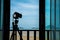 Silhouette camera on tripod at porch outside the room in the morning that can easy to shoot beautiful landscape